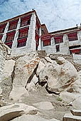 Ladakh - Tak Tok gompa, the main monastery halls with the characteristc red painted windows and woden balconies on white washed faades